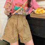 What color shirt goes with yellow shorts